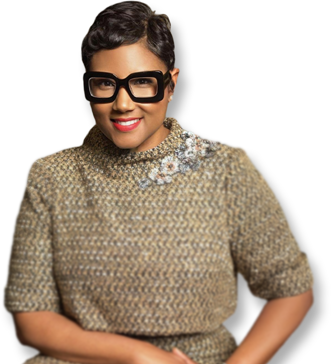 A professional portrait of DeKalb County CEO Lorraine Cochran-Johnson wearing stylish black glasses and an embroidered grey dress.